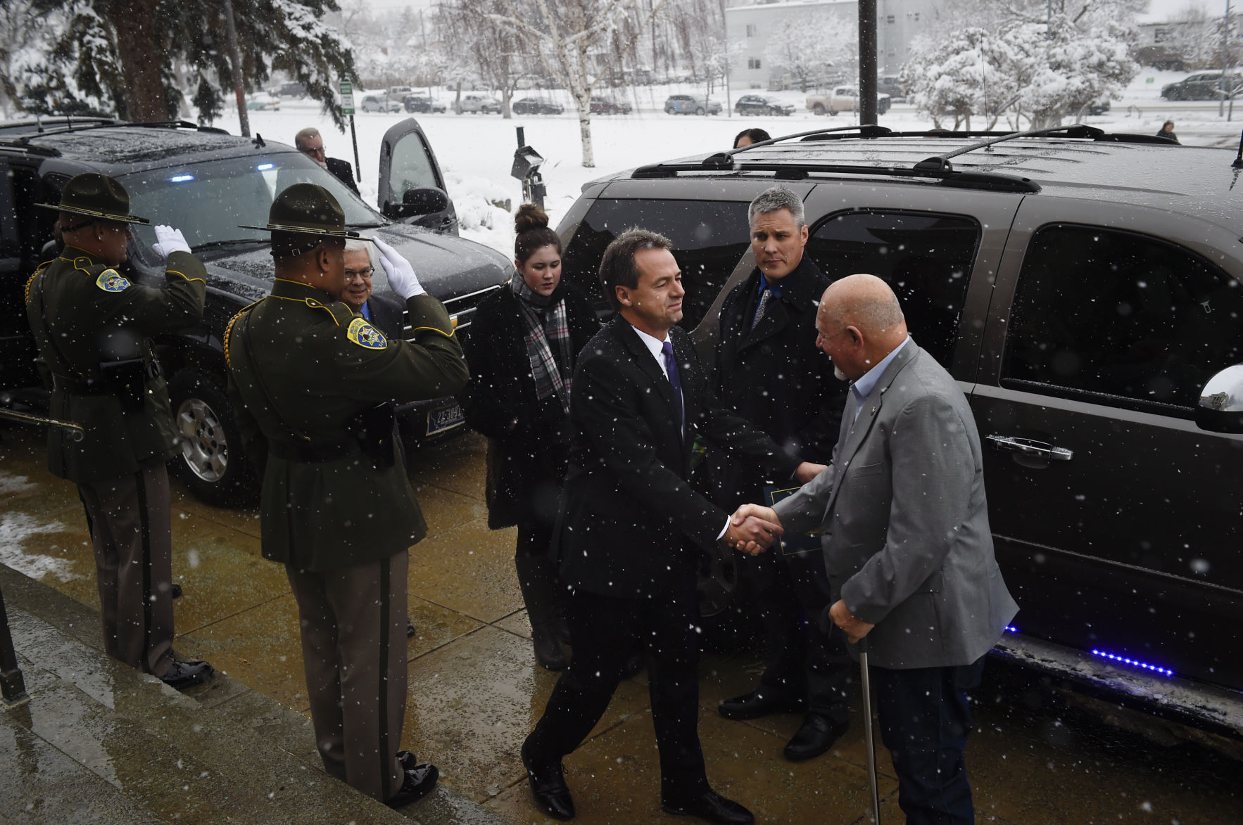 Governor Steve Bullock greets the Martz family on the steps of the State Capitol Friday morning.